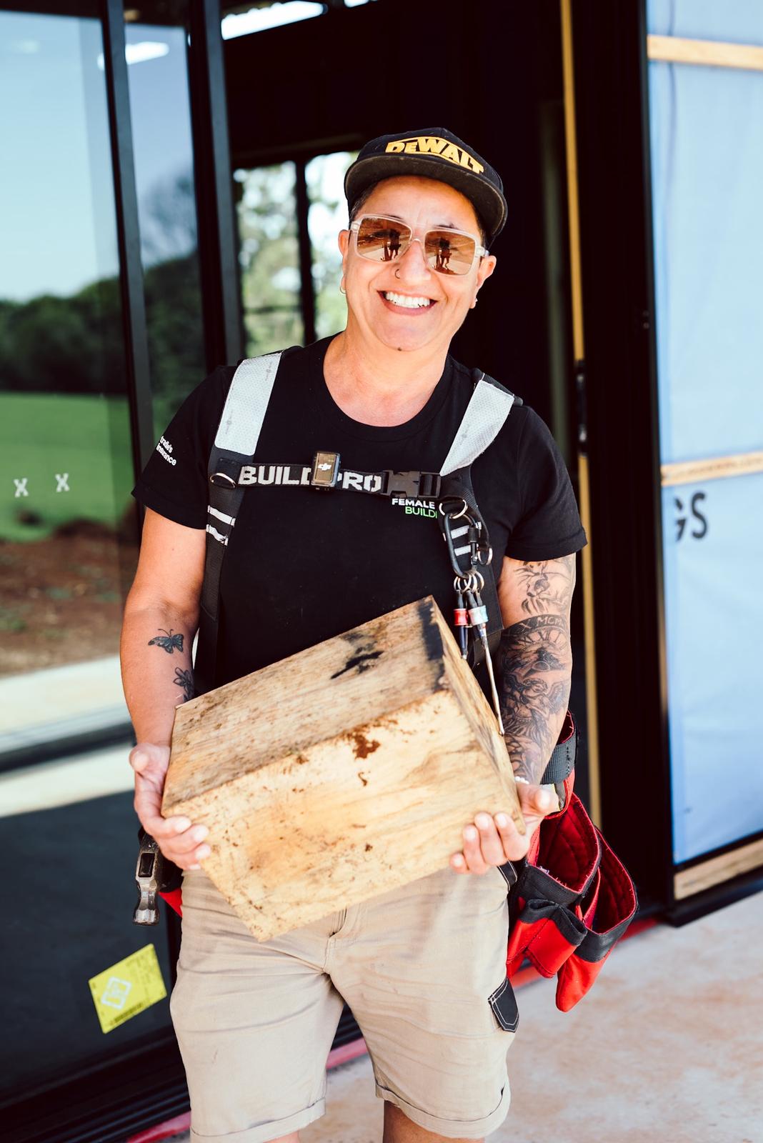 Penny Petridis confidently holding a timber block